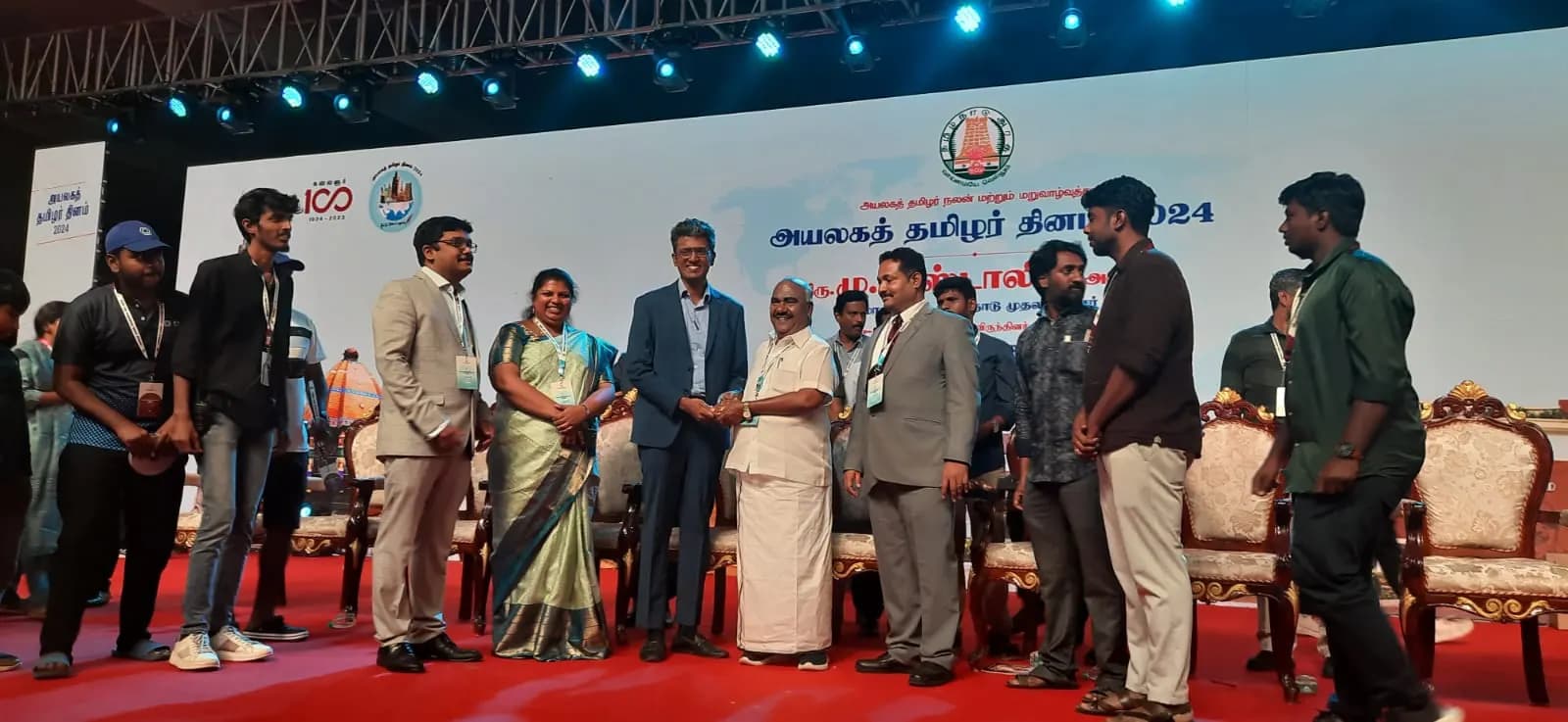 Arjun Charles receiving a commendation at World Tamil Diaspora Day 2024