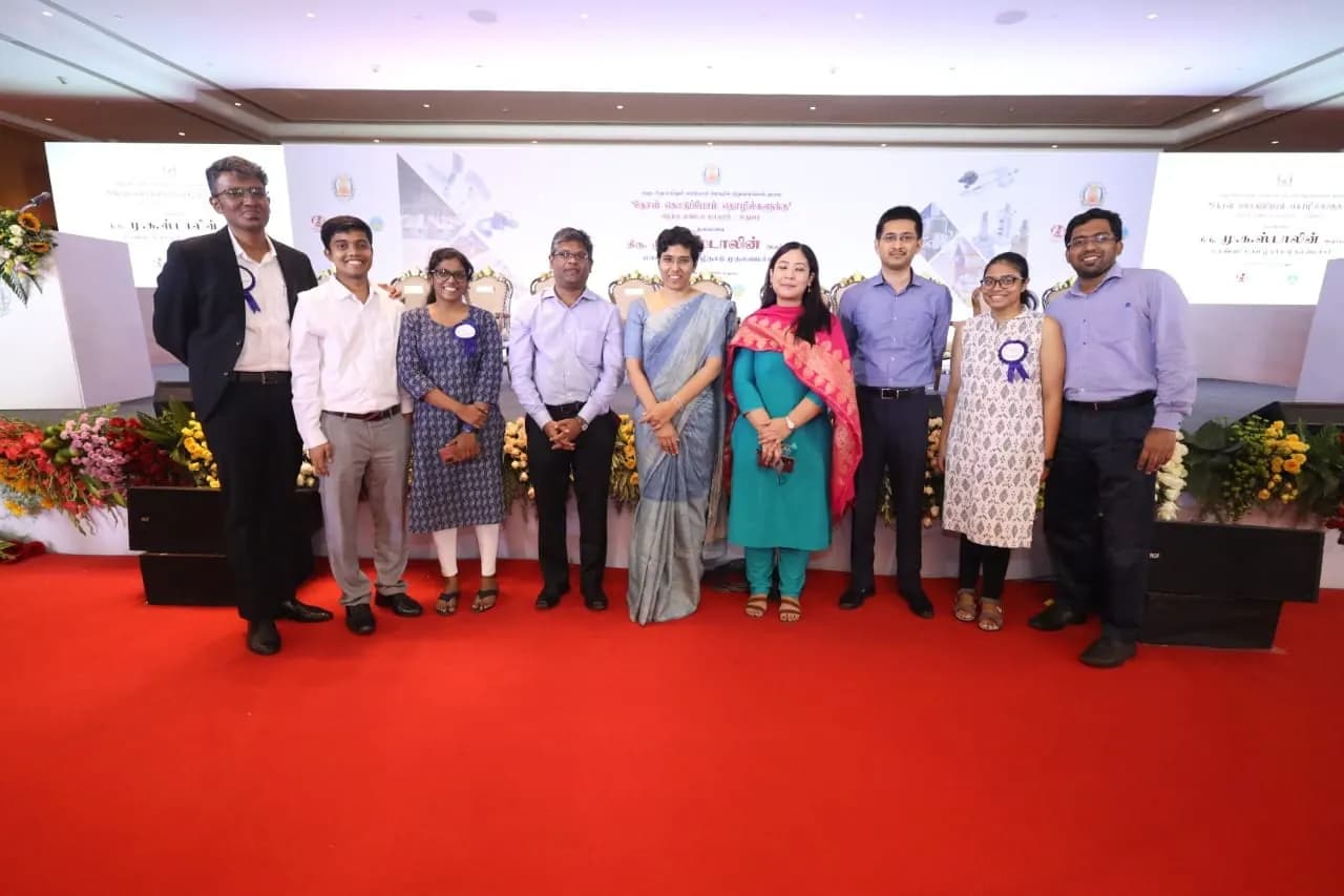The team with officials at a state event